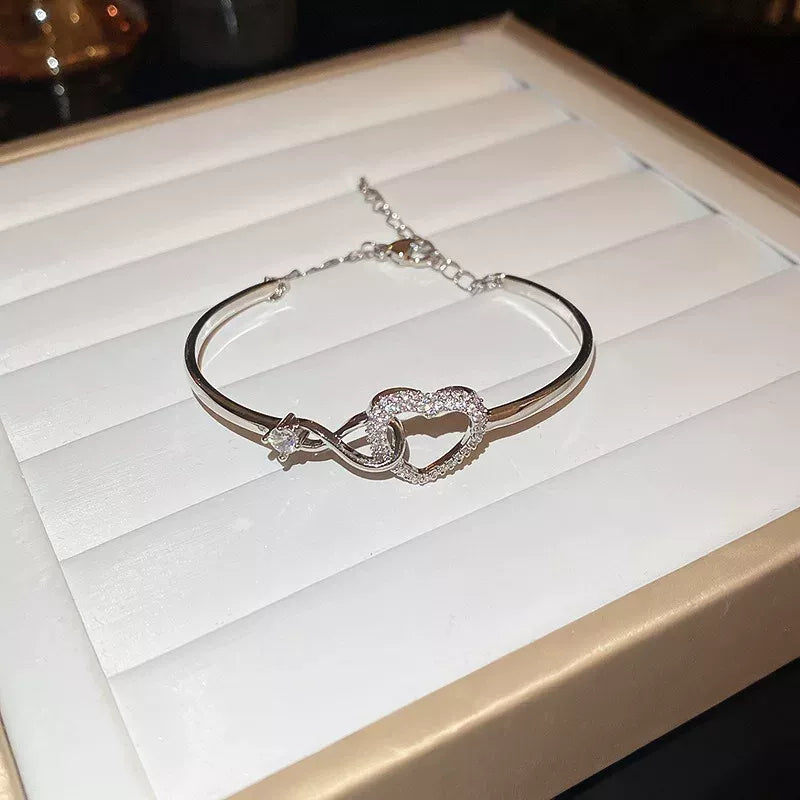 Sparkling Infinity Heart Bangle Bracelet for Women Silver Plated Cubic Zirconia Interlocking Endless Love Heart Cuff Bracelet Adjustable Commuter Jewelry Gift